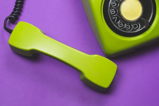 Phone with handset. vintage green telephone with phone receiver. office background. old communication technology. copy space