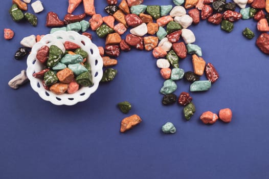 Candy bowl with sweets in the form of colored stones. colorful candies