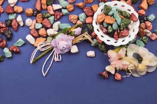 Festive decoration. lollipops and candy pebbles. sweets in the form of colored stones. colored background with colorful candies. copy space