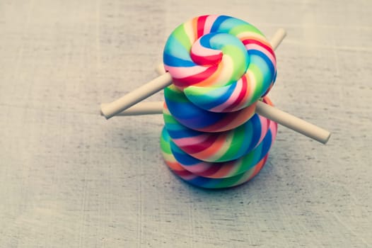 Lollipops on a wooden background. colorful candies close up. copy space