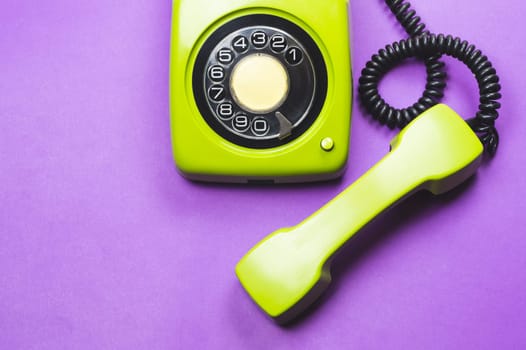 Phone with handset. vintage green telephone with phone receiver. office background. old communication technology. copy space
