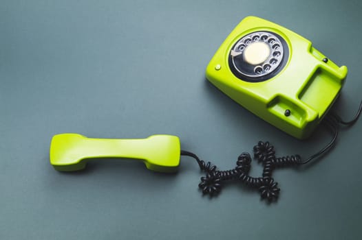 Classic phone with handset. vintage green telephone with phone receiver. office background. old communication technology. copy space