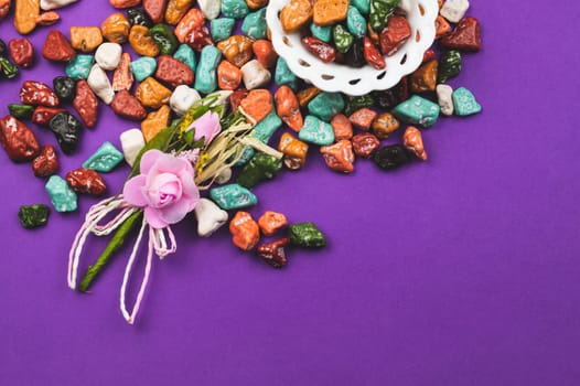 Festive decoration. lollipops and candy pebbles. sweets in the form of colored stones. colored background with colorful candies. copy space