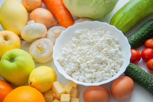 Fruits, vegetables and dairy products lie next to each other. . High quality photo