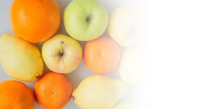 Fruits lie on a white background with space for text. . High quality photo