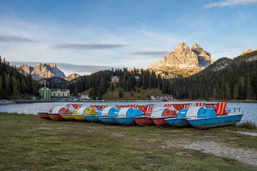 Lake Misurina or Lago di Misurina with pedal boats. View on the majestic Dolomites Alp Mountains, Tre Cime di Lavaredo peaks, South Tyrol, Italy