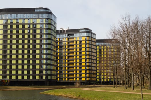 Modern buildings with lake and park. new constructed colorful building. modern residential construction