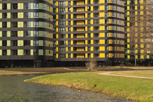 Modern buildings with lake and park. new constructed colorful building. modern residential construction