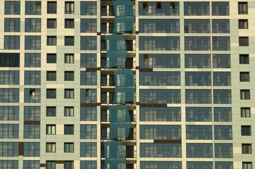Modern building wall. detail of new constructed colorful building. modern residential construction