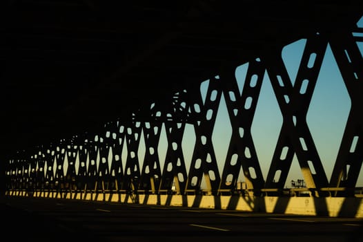 Metal bridge silhouette perspective view. industrial background