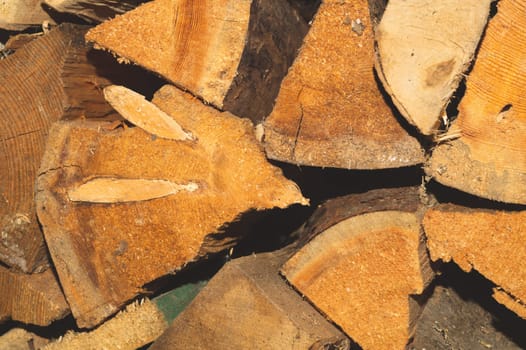 Stacks of firewood. preparation of firewood for the winter. pile of firewood