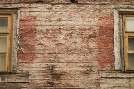 Windows of the old wooden house. wooden plank wall with windows background. copy dpace