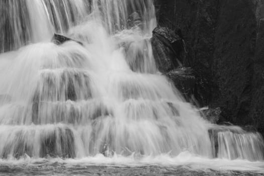 Waterfall background. rushing stream water. abstract backdrop