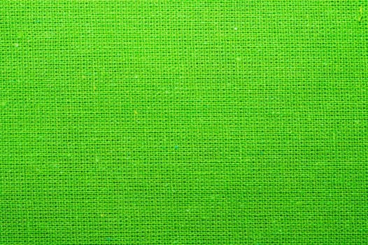 Green textile close up. knitted fabric texture. woven material background