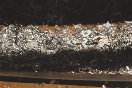 Twisted spiral steel shavings close up. drilling and lathe industry. metal engineering technology. metalworking process