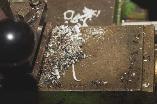 Old lathe. detail of rusty machine. vintage metalworking process close up. abstract industrial background