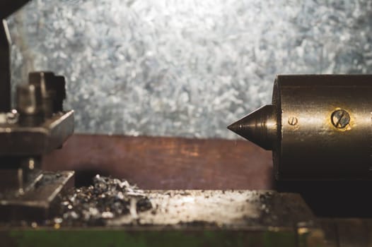 Old lathe. detail of rusty machine. metal mechanism. vintage metalworking machine close up. abstract industrial background