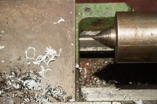 Old lathe. detail of rusty machine. metal mechanism. vintage metalworking machine close up. abstract industrial background