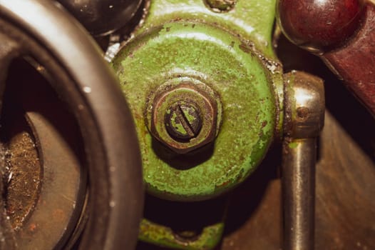 Old lathe. detail of rusty machine. metal mechanism. vintage metalworking machine close up. abstract industrial background