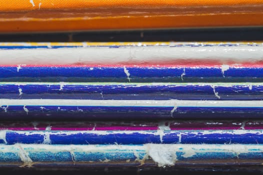 Stack of old magazines. pile of retro newspapers. vintage journals lie on top of each other. colorful background from the printed publications