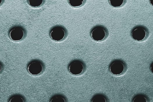 Holes in plastic surface. abstract pattern background