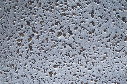 Grunge texture. gray wall close up. rough background. stone surface with spots
