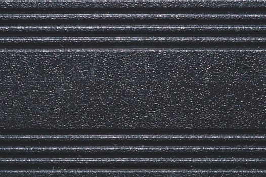 Black plastic texture. ribbed background