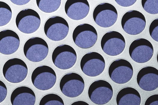 Steel plate with holes. metal grid with round cells. modern background. iron mesh