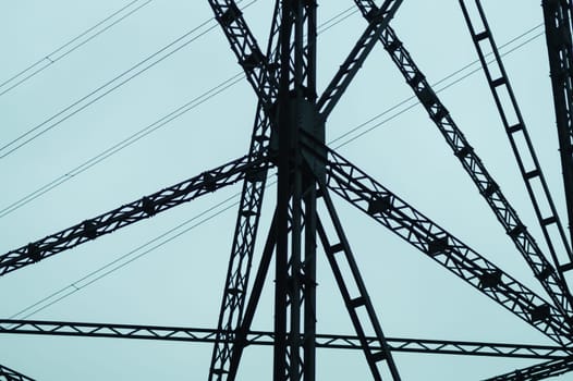 Detail of power line post. high voltage tower with the sky. industrial background