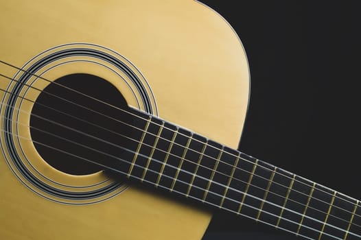 Acoustic guitar close up. musical instrument. strings on the guitar fretboard