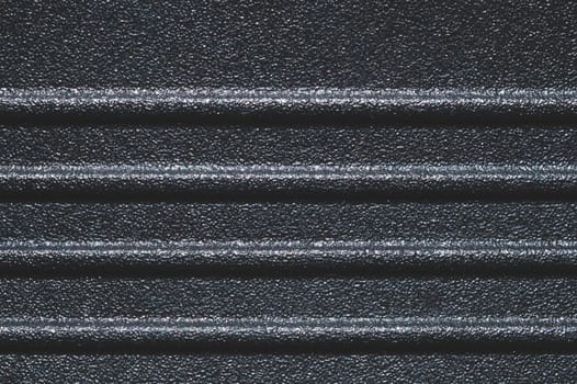 Black plastic texture. ribbed background