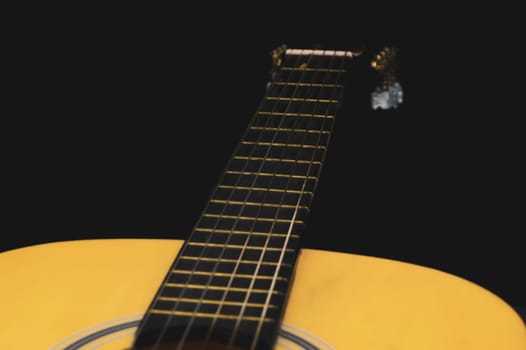 Acoustic guitar close up. musical instrument. strings on the guitar fretboard