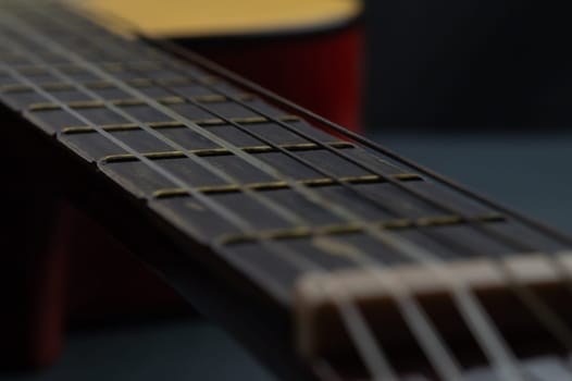 Acoustic guitar close up. musical instrument. strings on the guitar fretboard