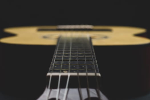 Acoustic guitar close up. musical instrument. strings on the guitar fretboard