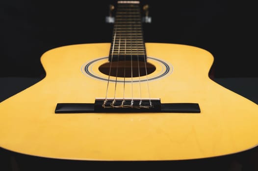 Acoustic guitar close up. musical instrument. strings on the guitar fretboard