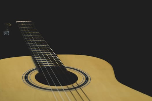 Acoustic guitar close up. musical instrument. strings on the guitar fretboard