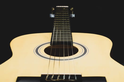 Acoustic guitar close up. musical instrument. strings on the guitar fretboard