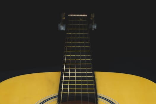 Acoustic guitar close up. musical instrument. strings on the guitar fretboard