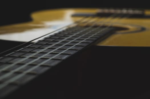 Acoustic guitar close up. musical instrument. strings on the guitar fretboard