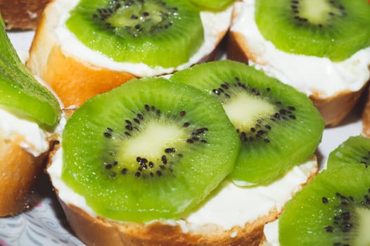 Sandwiches with kiwi. bread with fruit slices. background with appetizer
