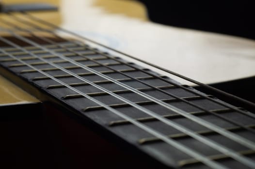Acoustic guitar close up. musical instrument. strings on the guitar fretboard