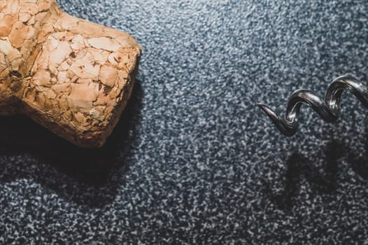 Wine cork and corkscrew on the table close up