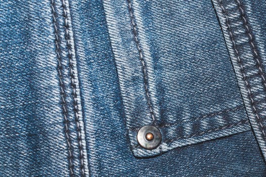 Jeans background with seams. denim texture close up. fabric backdrop with stitches