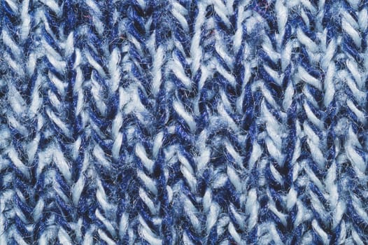 Blue knitted background. woolen texture. fibers pattern close up