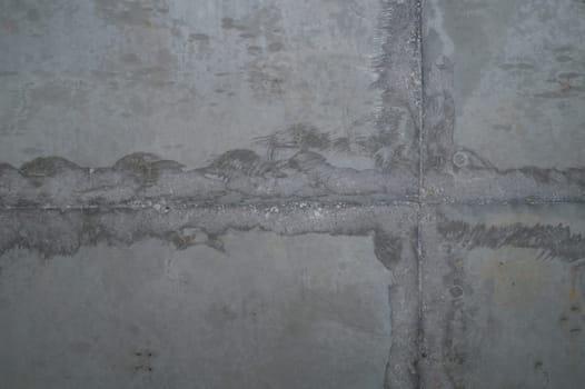 Concrete wall with cracks and scratches. abstract gray background with patterns. wall is ready for renovation works