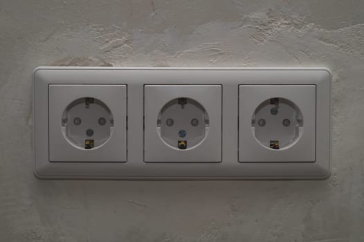 Power socket in the wall. electrical outlet close up. process of renovation