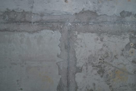 Concrete wall with cracks and scratches. abstract gray background with patterns. wall is ready for renovation works