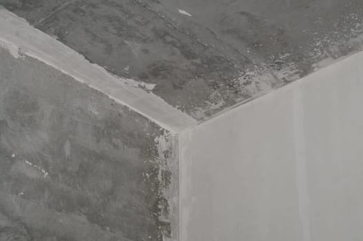 Corner between ceiling and walls. interior construction. renovation process. concrete surface
