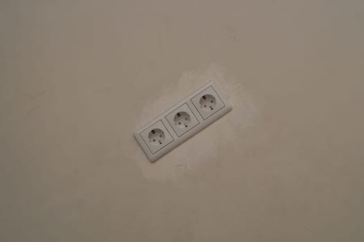 Power socket in the wall. electrical outlet close up. process of renovation
