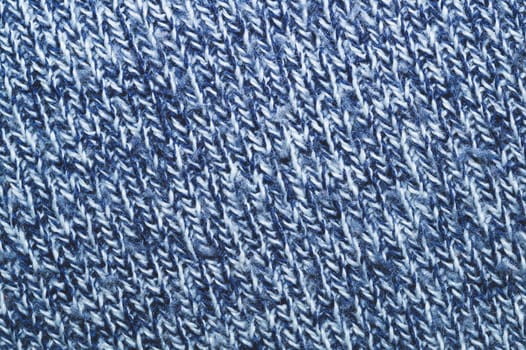 Blue knitted background. woolen texture. fibers pattern close up